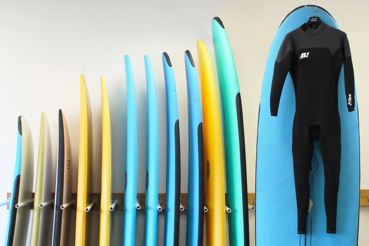 Soft Top Surfboard rack with Wetsuit at Board Members shop